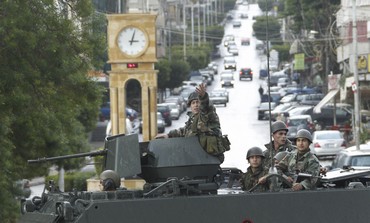 Lebanese soldiers on their military vehicle