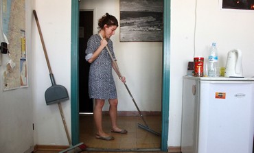 A woman cleans.