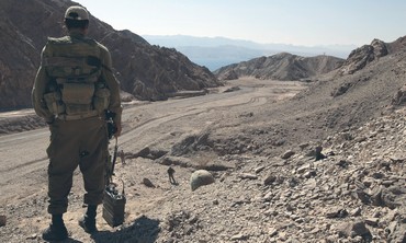 AN IDF soldier stands guard near the Israeli-Egyptian border.