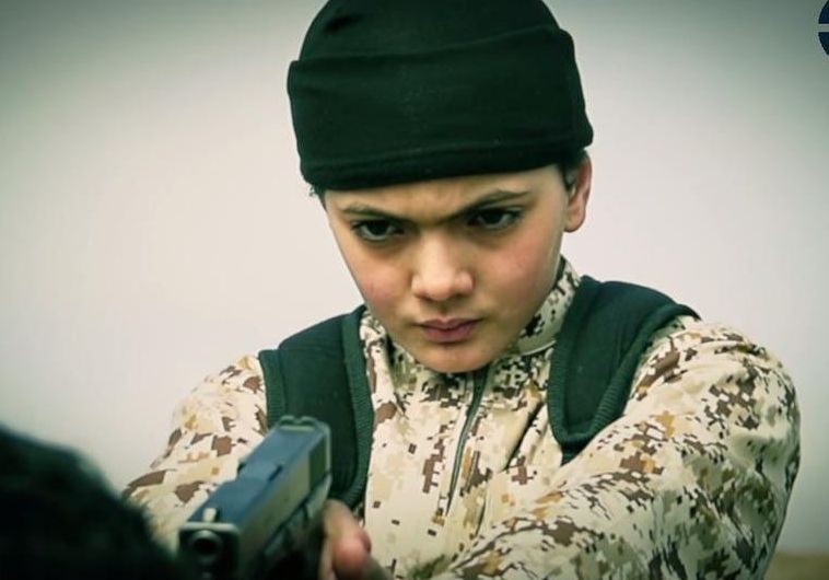 The young boy who appears in the ISIS video moments before purportedly executing 'an Israeli spy'