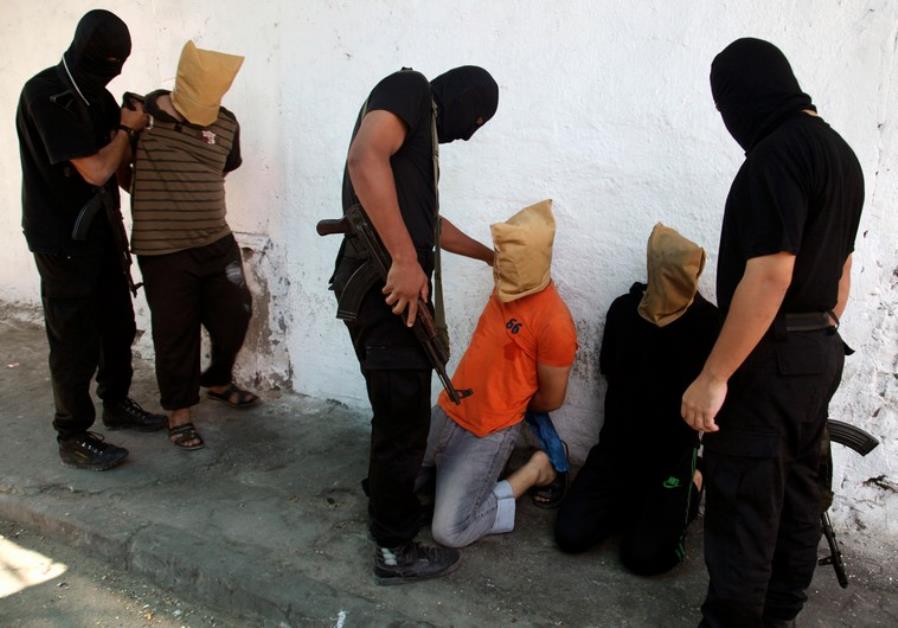 Hamas publicly executes 3 Palestinians by firing squad, hanging Arab