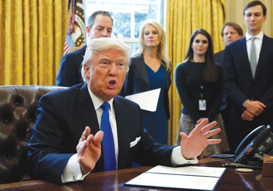 US PRESIDENT Donald Trump speaks to reporters while signing executive orders at the White House.