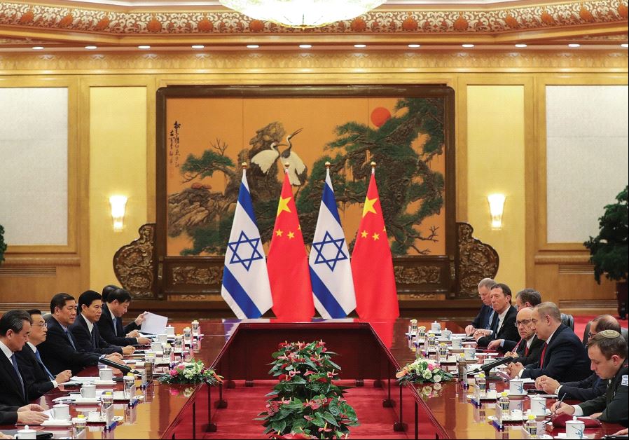 CHINESE AND ISRAELI officials meet at the Great Hall of the People on Monday in Beijing. Israeli bus