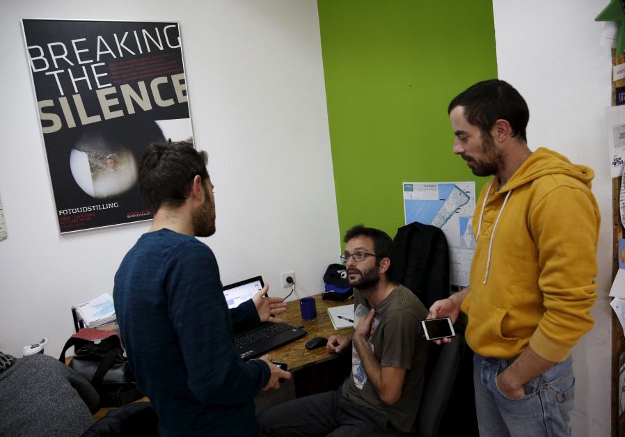 Employees work at the offices of "Breaking the Silence" in Tel Aviv, Israel