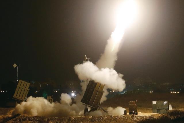 An iron dome launches rockets to intercept incoming rockets from Gaza on Tuesday. (photo credit: REUTERS)