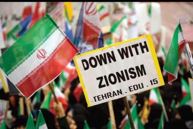 Iranian students hold anti-Israeli placards and Iranian flags during a rally outside the former US embassy in Tehran in 2009 (photo credit: REUTERS)