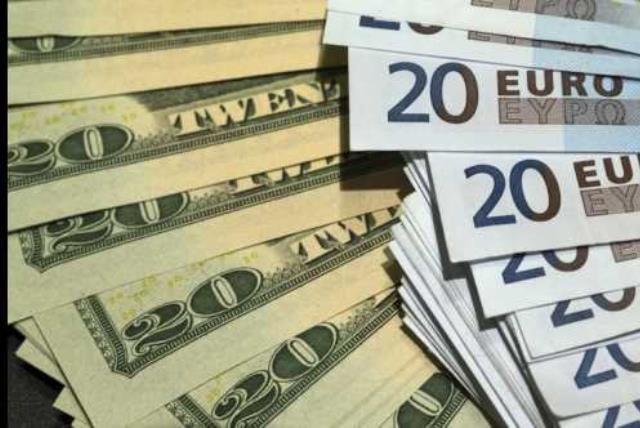 US dollars and euros banknotes are seen in this illustration photo (photo credit: REUTERS)