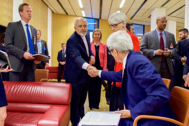 U.S. Secretary of State John Kerry shakes hands with Iranian Foreign Minister Javad Zarif as he prepares to leave the Austria Center in Vienna, Austria, on July 14, 2015, after the European Union, United States, and the rest of its P5+1 partners reached agreement on a plan to prevent Iran from obtai (photo credit: STATE DEPARTMENT PHOTO)