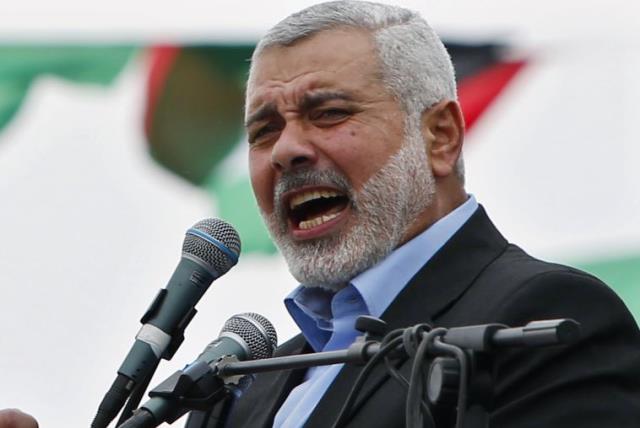 Ismail Haniyeh talks to his supporters during a Hamas rally in Gaza City (photo credit: REUTERS)