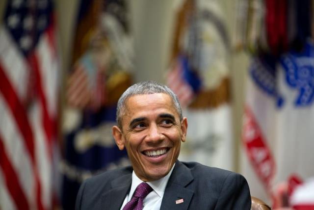 US President Barack Obama laughs during a meeting at the White House (photo credit: OFFICIAL WHITE HOUSE PHOTO / PETE SOUZA)