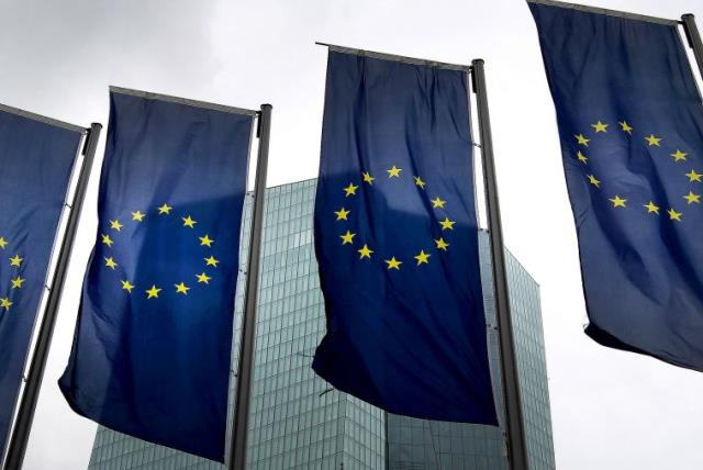 EU flags (photo credit: AFP/ DANIEL ROLAND)