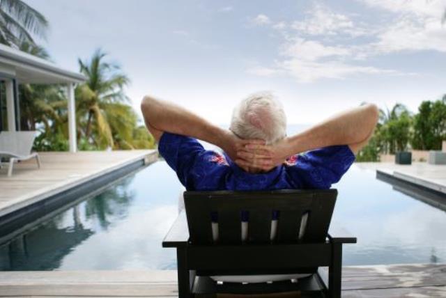 Illlustrative photo of a man relaxing on vacation (photo credit: INGIMAGE)