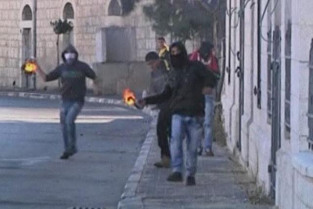 Palestinians stone throwing youths clash with Israeli troops (photo credit: REUTERS)