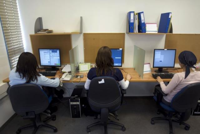 Ultra-Orthodox women work at Matrix Global, a hi-tech company, in the West Bank Jewish settlement of Modiin Illit April 3, 2011 (photo credit: REUTERS)