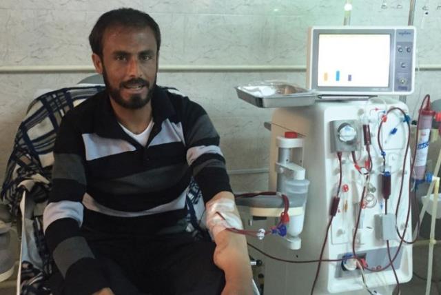 AHMED HAMZEH, a refugee from Deraa in Syria now living in Jordan’s Zaatari refugee camp, undergoes dialysis treatment yesterday at Irbid’s Islamic Hospital. (photo credit: SETH J. FRANTZMAN)