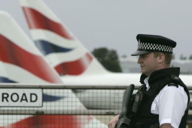 An armed policeman patrols Heathrow Airport, London (photo credit: REUTERS)