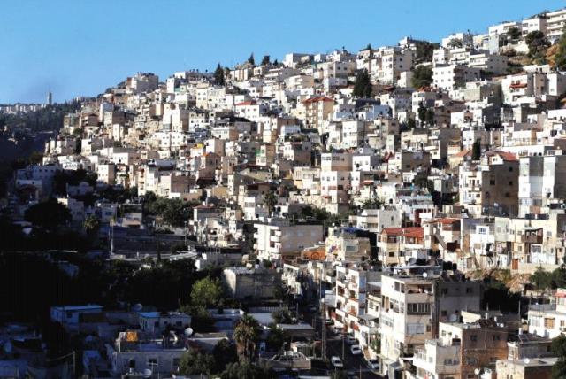 SILWAN, an Arab neighborhood close to Jerusalem’s Old City, one of many places the author claims Arab residents are being displaced from (photo credit: REUTERS)