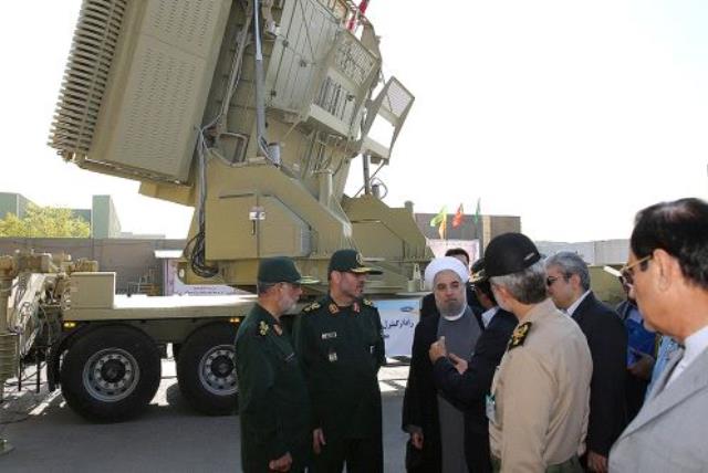 Iran's President Hassan Rouhani (3rd L) and Iranian Defence Minister Hossein Dehghan (2nd L) stand in front of the new air defense missile system Bavar-373, in Tehran, Iran August 21, 2016 (photo credit: REUTERS)