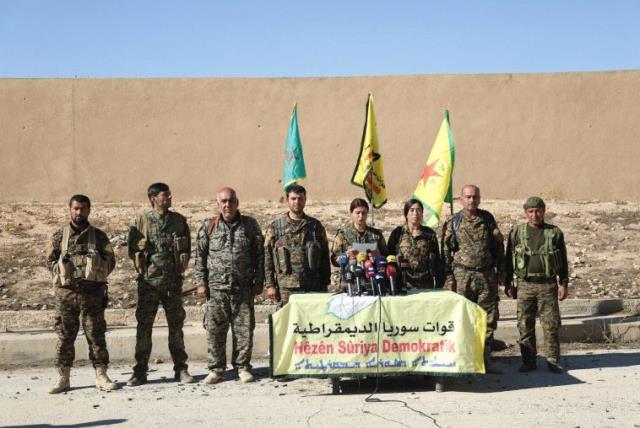 SYRIAN DEMOCRATIC FORCES commanders announce an offensive to take the ISIS-held city of Raqqa last week. (photo credit: RODI SAID / REUTERS)