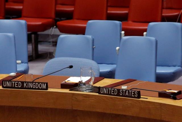 The seats of Britain and the United States sit empty in the United Nations Security Council chamber. (photo credit: REUTERS)