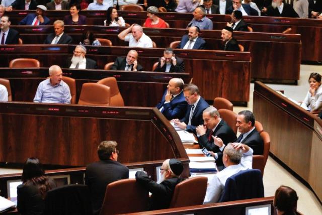 SHOW US the money. Lawmakers attend a preliminary vote on a bill at the Knesset (photo credit: REUTERS)