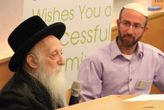 Rabbi Dr. Abraham J. Twerski (left) with Crossroads executive director Robbie Sassoon during the opening talk at the December 12 conference (photo credit: ROBBIE SASSOON)