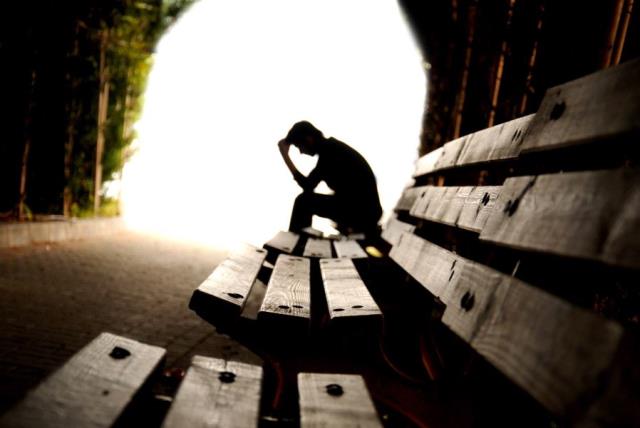 Sad person in tunnel (illustrative) (photo credit: INGIMAGE)