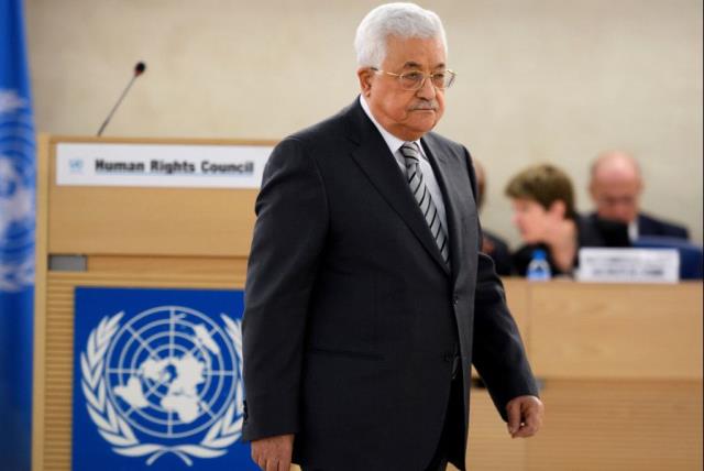 Palestinian President Mahmud Abbas arrives to delivers a speech during the United Nations Human Rights Council on February 27, 2017 in Geneva (photo credit: FABRICE COFFRINI / AFP)