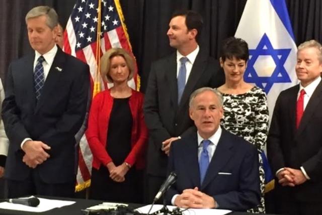 Texas Governor Greg Abbott signs anti-BDS bill into law (photo credit: JENNIFER KAUFMAN)