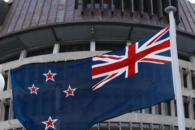 The current New Zealand flag flies on Parliament buildings in Wellington's Central Cusiness District on March 24, 2016. (photo credit: AFP PHOTO)