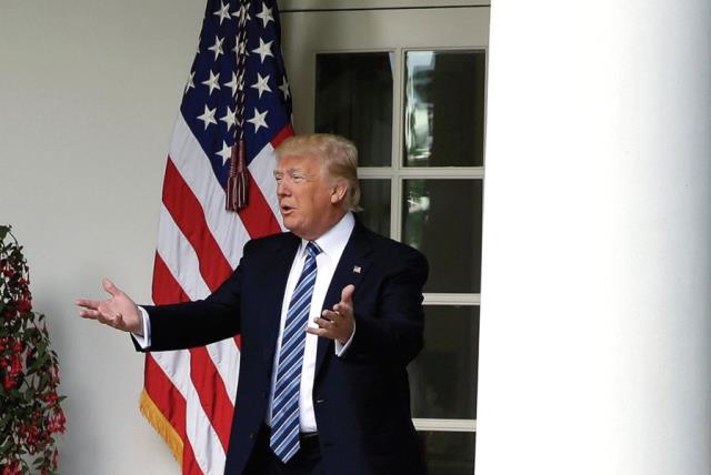 US PRESIDENT Donald Trump gestures to the press (photo credit: REUTERS)