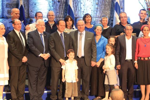 THE FRAENKEL, Shaer and Yifrach families, with President Reuven Rivlin and Jerusalem Mayor Nir Barkat at the Jerusalem Unity Prize award ceremony. (photo credit: SASSON TIRAM)