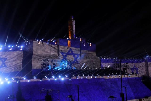 Israel's national flag is projected on the wall near the Tower of David in the Old City of Jerusalem May 20, 2017 (photo credit: RONEN ZVULUN/REUTERS)