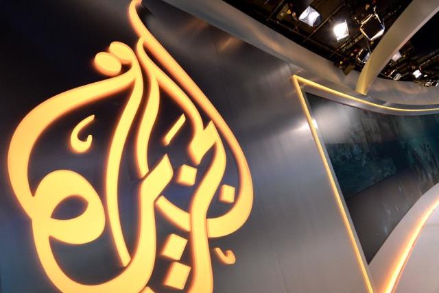 The Al Jazeera logo seen in a studio [Illustrative] (photo credit: AFP / STAN HONDA)