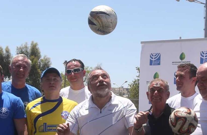 Avigdor Liberman plays soccer (photo credit: MARC ISRAEL SELLEM/THE JERUSALEM POST)