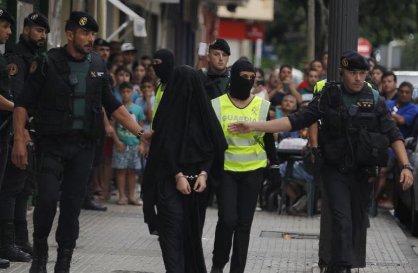 An 18-year-old Moroccan woman in Spain arrested under suspicions of being part of Islamic State.  (photo credit: JOSE JORDAN / AFP)