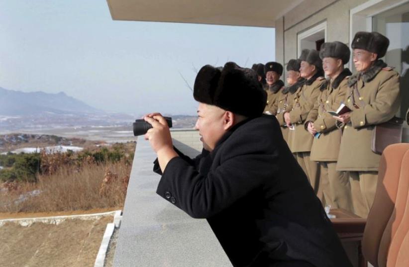 North Korean leader Kim Jong Un watches maneuvers between KPA large combined units 526 and 671 at undisclosed location in   this undated photo released by North Korea's Korean Central News Agency (photo credit: REUTERS)