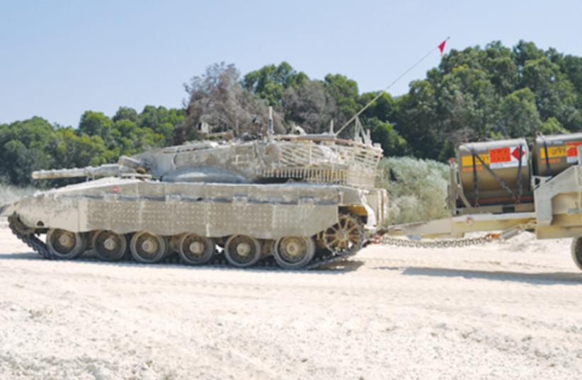 THE TWO-WHEELED BACKTRAIL (right) can carry 8 tons of supplies (photo credit: COURTESY URDAN)