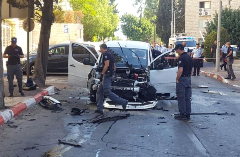 An exploded car in Jerusalem.  (photo credit: POLICE SPOKESPERSON'S UNIT)