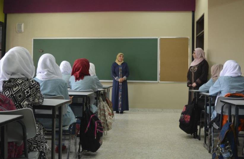Students in classroom at Aqqaba Secondary Girls' School. (photo credit: UDI SHAHAM)