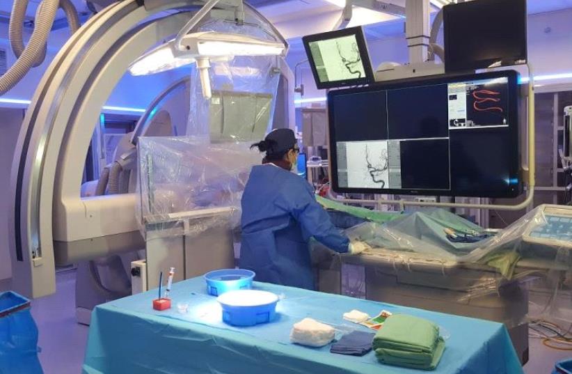 Dr. Anat Horev performs a brain catheterization live on Facebook (photo credit: SOROKA MEDICAL CENTER)