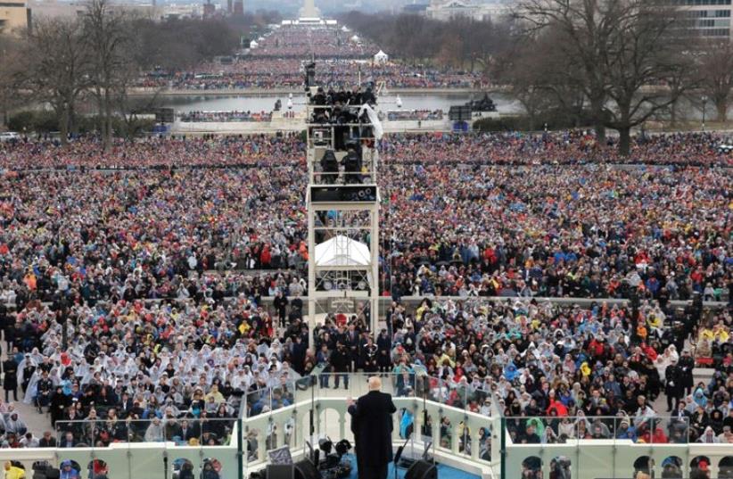 PRESIDENT DONALD TRUMP speaks Friday at the Capitol after taking the oath of office. (photo credit: REUTERS)