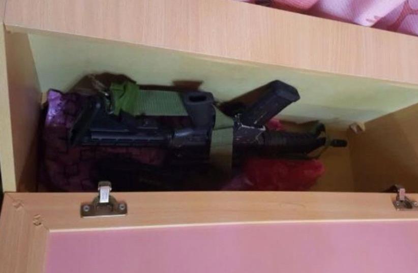 IDF finds gun under childs bed in raid. (photo credit: IDF)