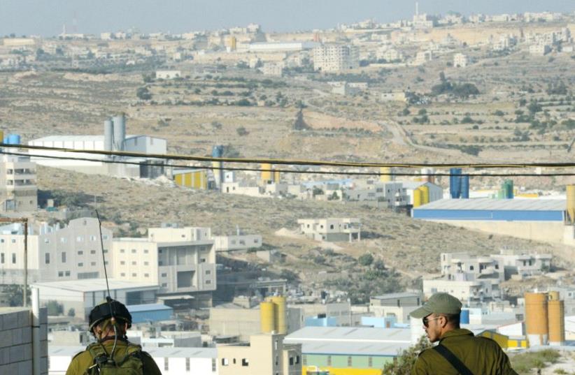 Soldiers overlook the Hebron region in 2014 (photo credit: KOBI GIDEON/GPO)