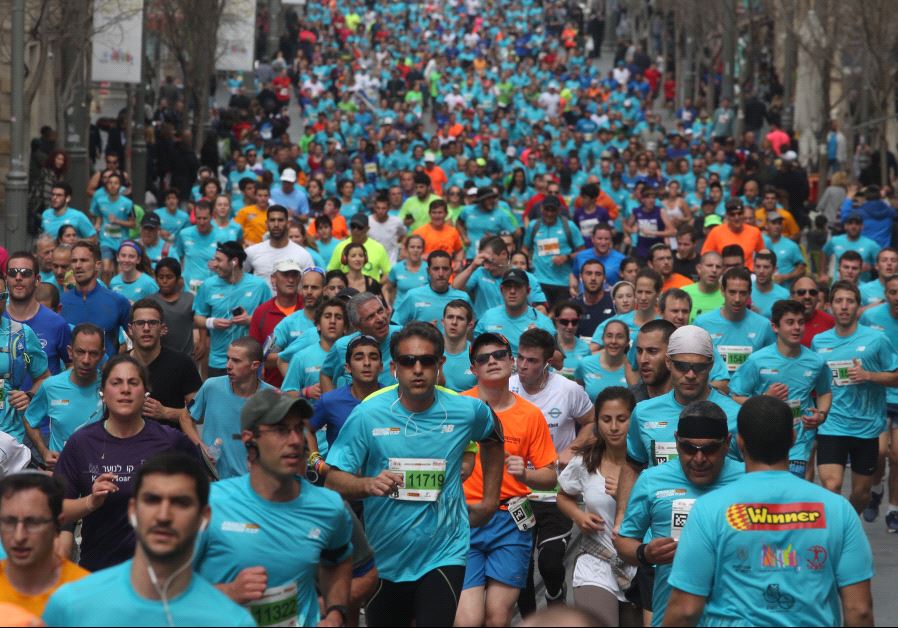 IN PICTURES Tens of thousands run in Jerusalem marathon Israel News