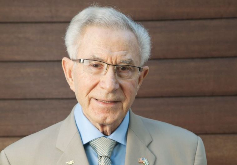 Holocaust survivor Ben Lesser with his memoir. (credit: Courtesy)